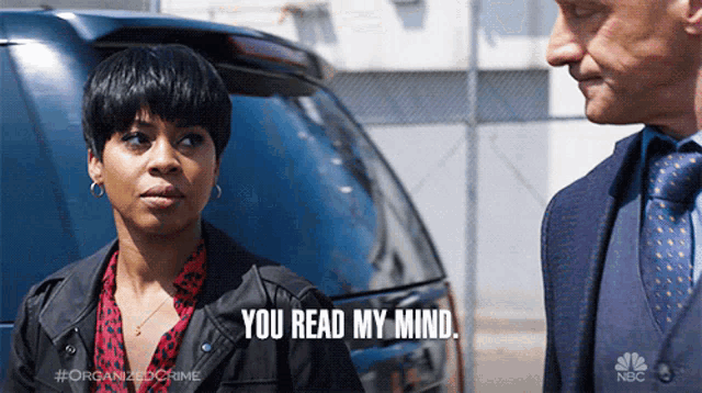 a man and a woman are standing next to each other and the woman says " you read my mind "