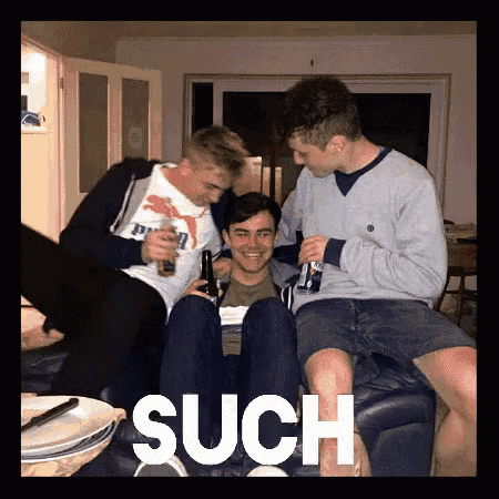a group of young men are sitting on a couch and the word such is on the bottom