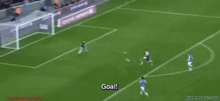 a goal is scored on a soccer field with a qatar airways ad behind the goal