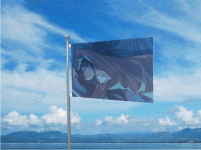a flag with a picture of a person on it flies in the wind