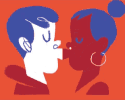 a man and a woman are kissing each other on the cheek