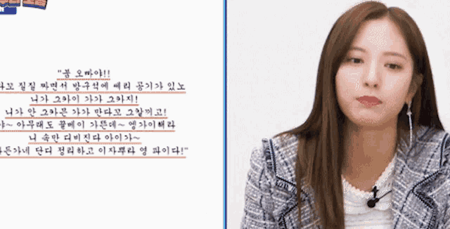 a woman in a plaid jacket is standing in front of a white background