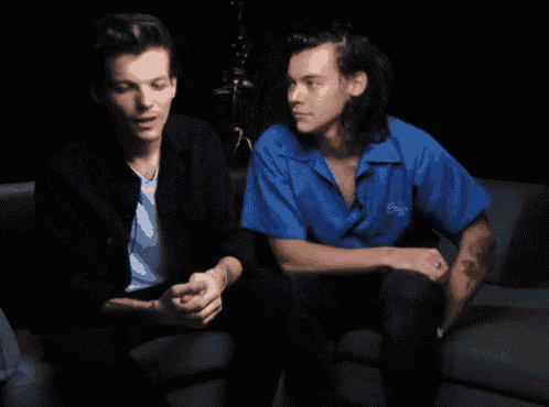 two men are sitting next to each other and one of them says well said
