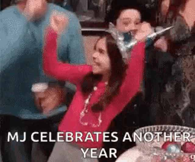 a girl wearing a party hat is celebrating the new year with her friends .