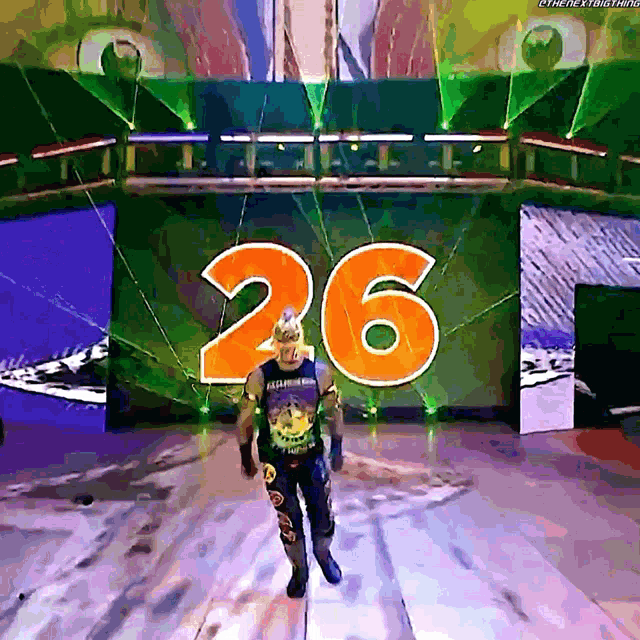a wrestler with the number 26 on a stage
