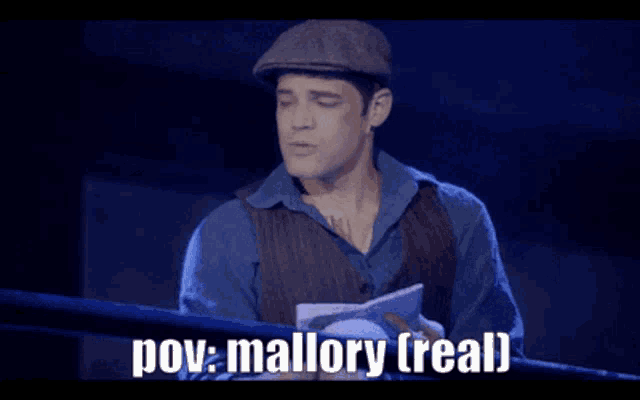 a man is holding a piece of paper and saying " pov mallory real "