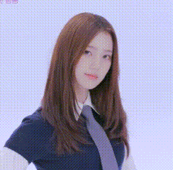 a young woman with long hair is wearing a tie and a school uniform .