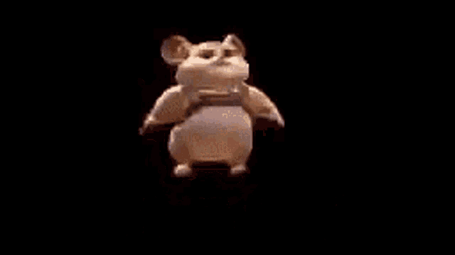 a hamster is dancing in front of a black background with the words `` calla mierda '' written above it .