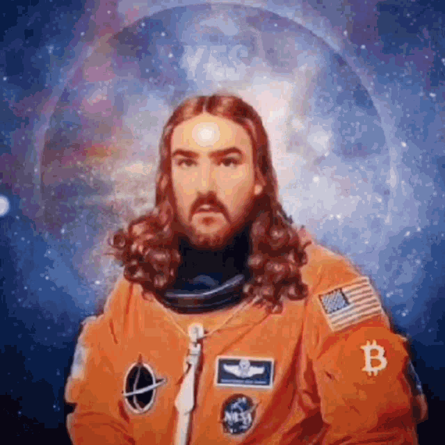 a man with long hair and a beard is wearing a nasa space suit