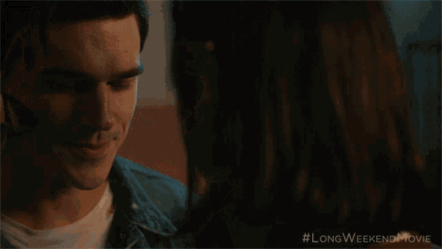 a woman is hugging a man in a longweekend movie