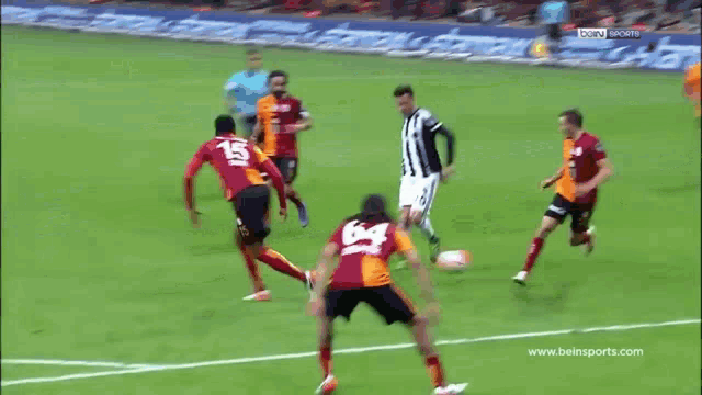 a soccer game is being played on a tv channel that says bein sports