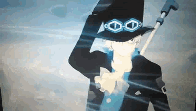 a man wearing a hat and goggles holds a cane