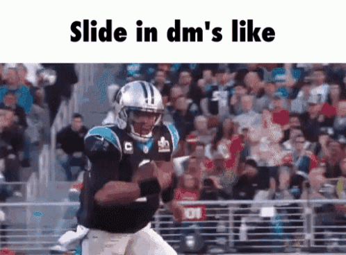 a football player is running with a ball in front of a crowd .