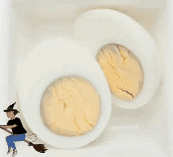 two hard boiled eggs with a witch on a broom