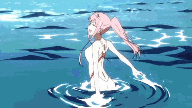 a girl with pink hair is standing in the water with her arms outstretched