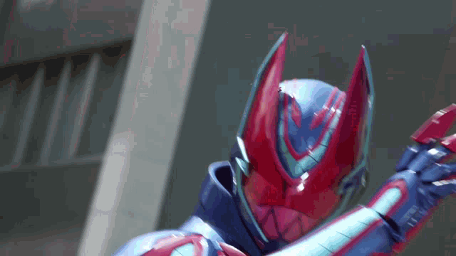 a close up of a robot with a red and blue helmet on