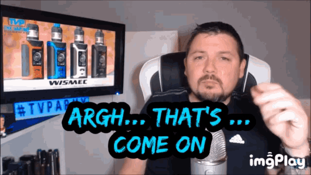 a man sitting in front of a tv says " argh that 's ... come on "