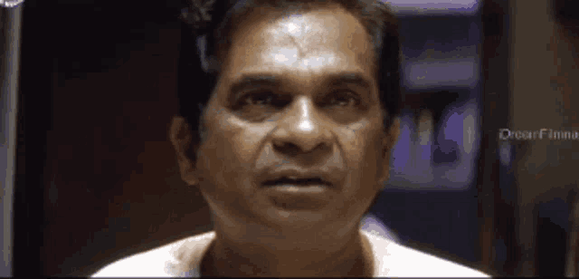 a close up of a man 's face with the word dreamfinna on the bottom right corner