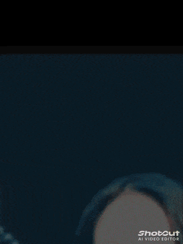 a blue background with a shotcut al video editor logo