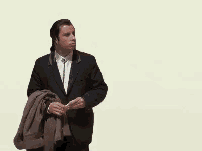 a man in a suit is standing next to a cartoon of a man