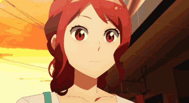 a girl with red hair is looking up at something