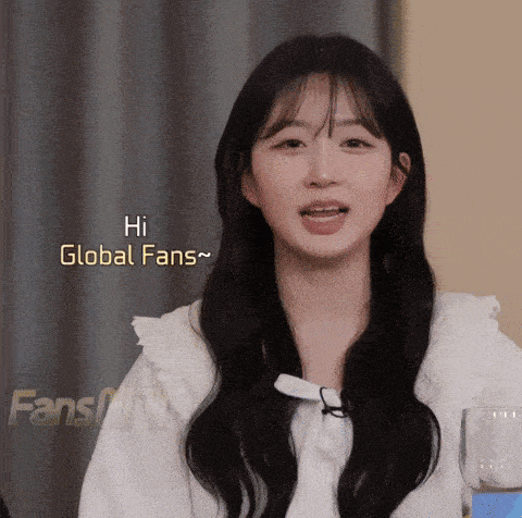 a girl says hi global fans in a video