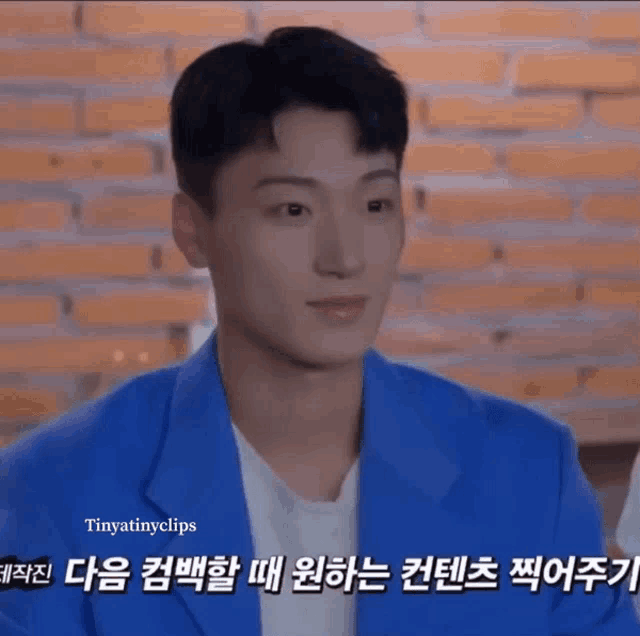 a man in a blue jacket with tinytinylips in the corner