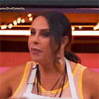 a woman in a yellow tank top and white apron