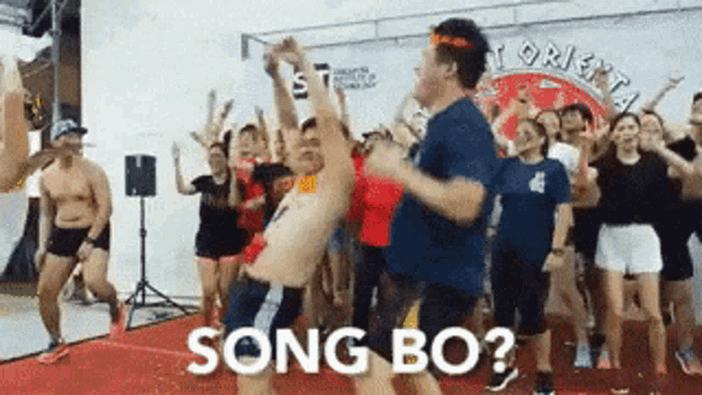 a group of people are dancing in a room with the words song bo written on the bottom