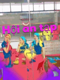 a group of people are standing in front of a sign that says hoian tap