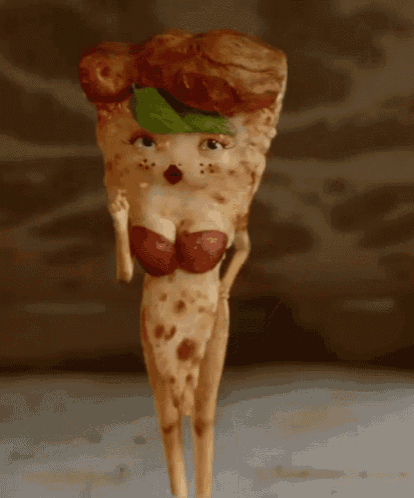a slice of pizza that looks like a woman with a leaf on her head