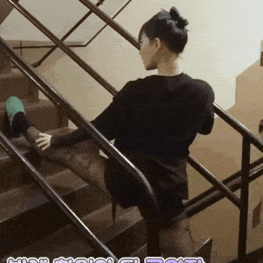 a woman stretches her leg on a set of stairs with a caption that says ' high heels ' on it