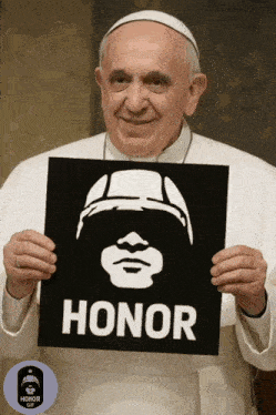 a man holds up a sign that says honor