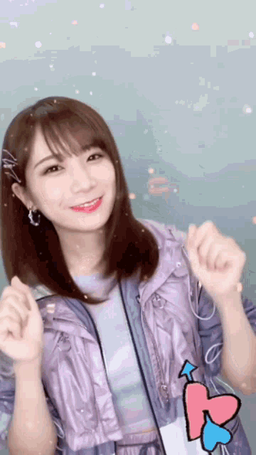 a woman wearing a purple jacket and a purple shirt