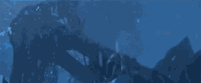 a close up of a blue background with a few waves