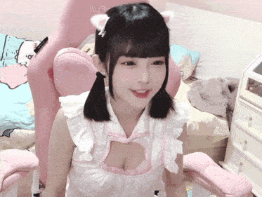 a girl is sitting in a pink chair with the word lufr on the back