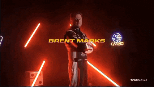 a person is holding a piece of paper that says brent marks