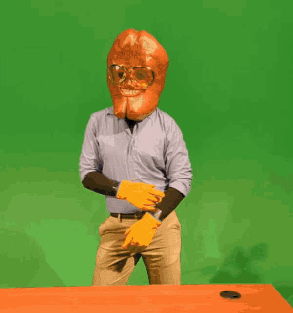 a man with a hamburger head on his head giving a thumbs up sign