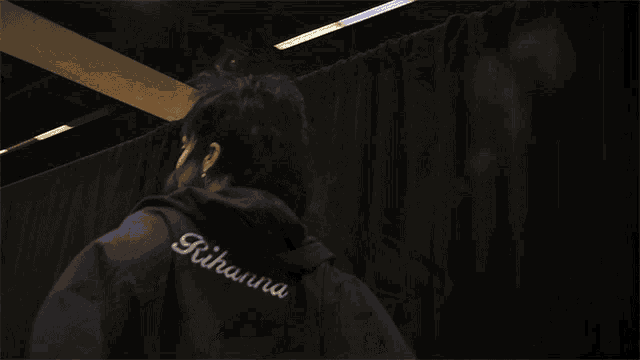 a person wearing a black hoodie that says ' u.s. army ' on it