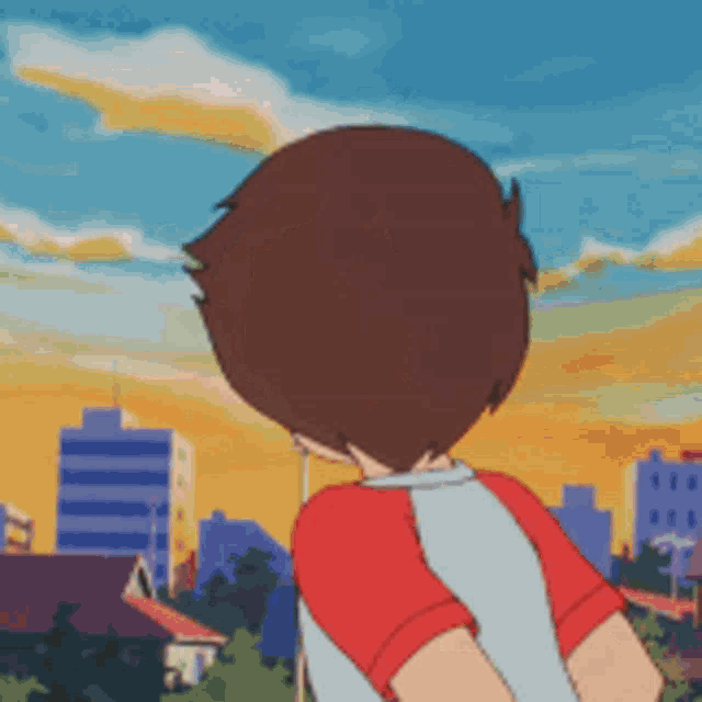 a boy in a red and white shirt is standing in front of a city skyline