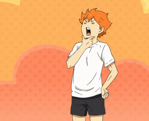 a boy with orange hair is wearing a white t-shirt and black shorts