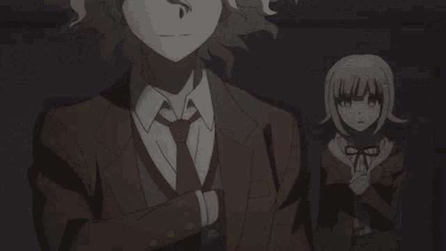 a man in a suit and tie is holding a gun next to a girl in a school uniform