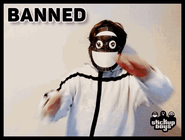 a person wearing a mask with the word banned written on it