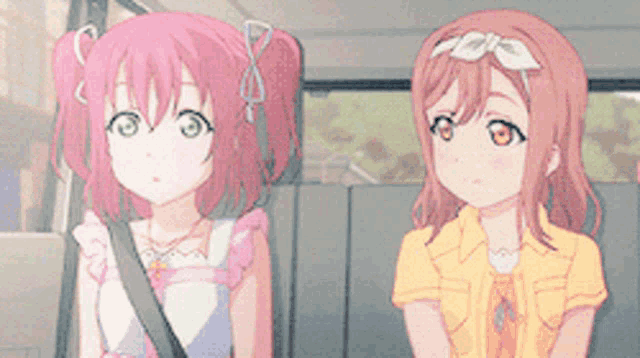 two anime girls are sitting in the back seat of a car with their eyes closed
