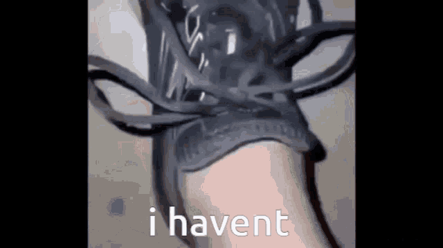 a close up of a person 's foot with a shoe on and the words `` i haven 't '' .
