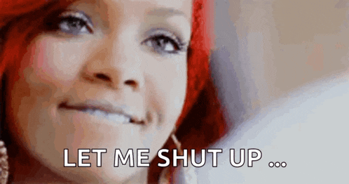 a close up of a woman with red hair saying `` let me shut up '' .