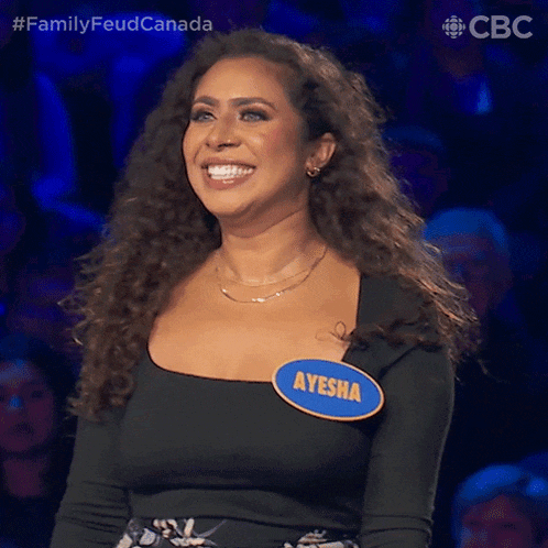 a woman with a name tag that says ayesha smiles