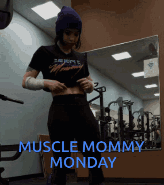 a muscle mommy monday poster with a woman in a gym