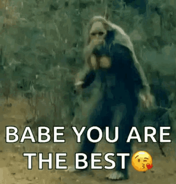 a monkey is walking in the dirt with the words `` babe you are the best '' .
