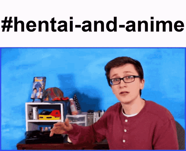 a man with glasses is standing in front of a blue wall with the words hentai-and-anime written on it